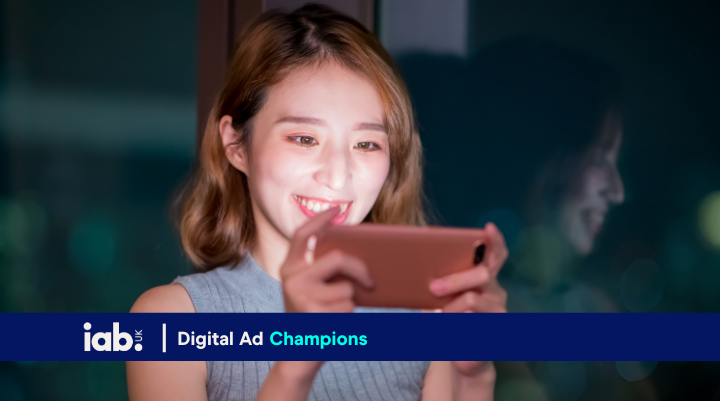 woman playing games on her phone 